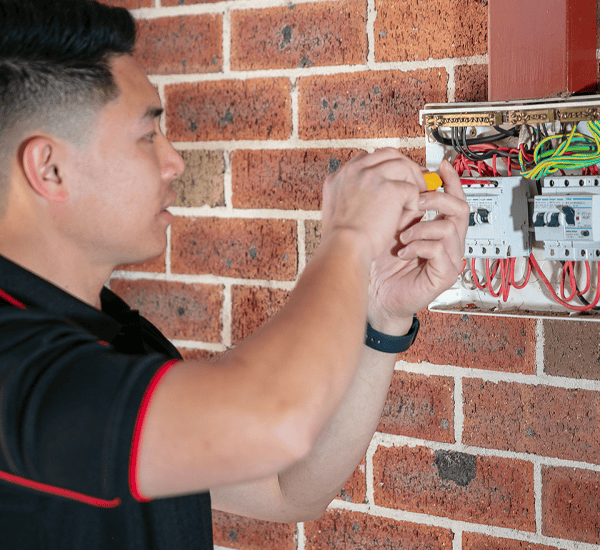 electrician repairing switchboard at a Sydney home