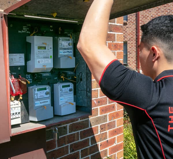Electrician repairing an EV charger station