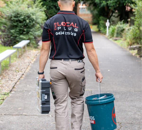 electrician heading to the job site to fix an electrical issue