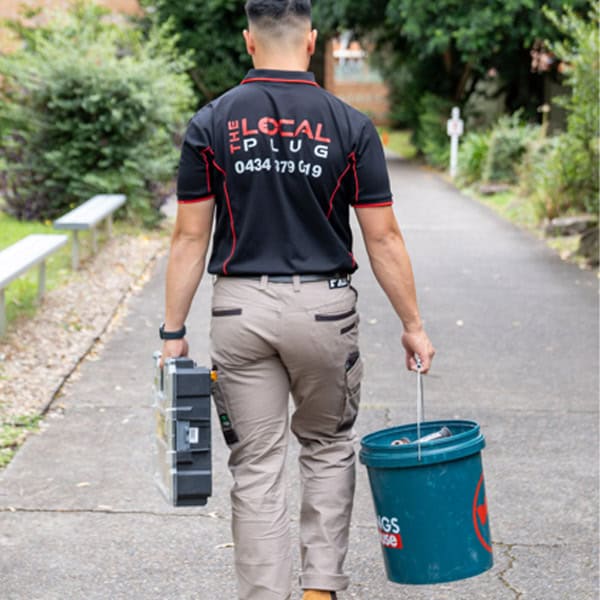 electrician heading to the job site to fix an electrical issue