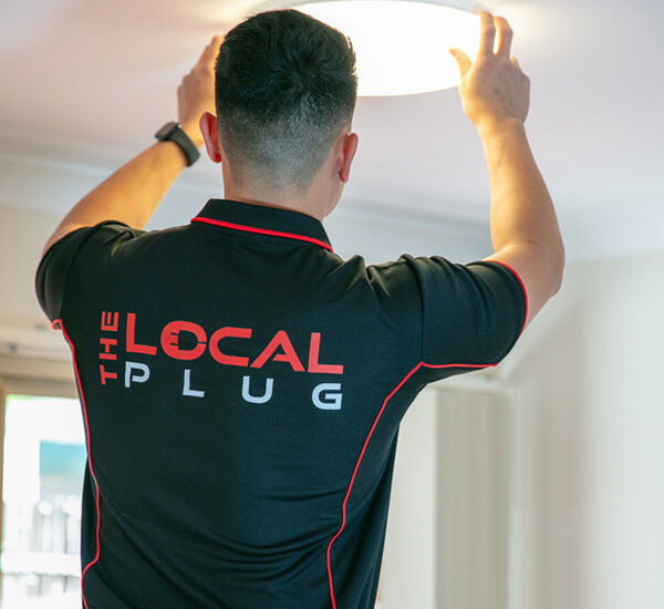 the local plug electrician installing a light in sydney home
