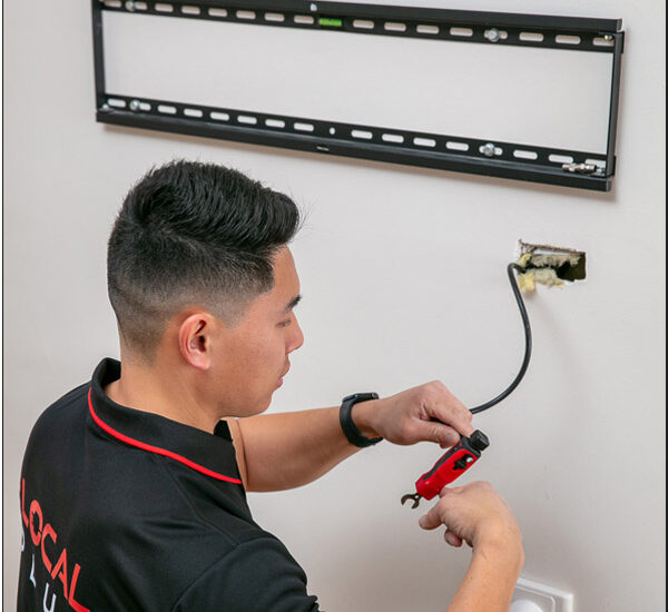 our electrician fixing the tv wall mount